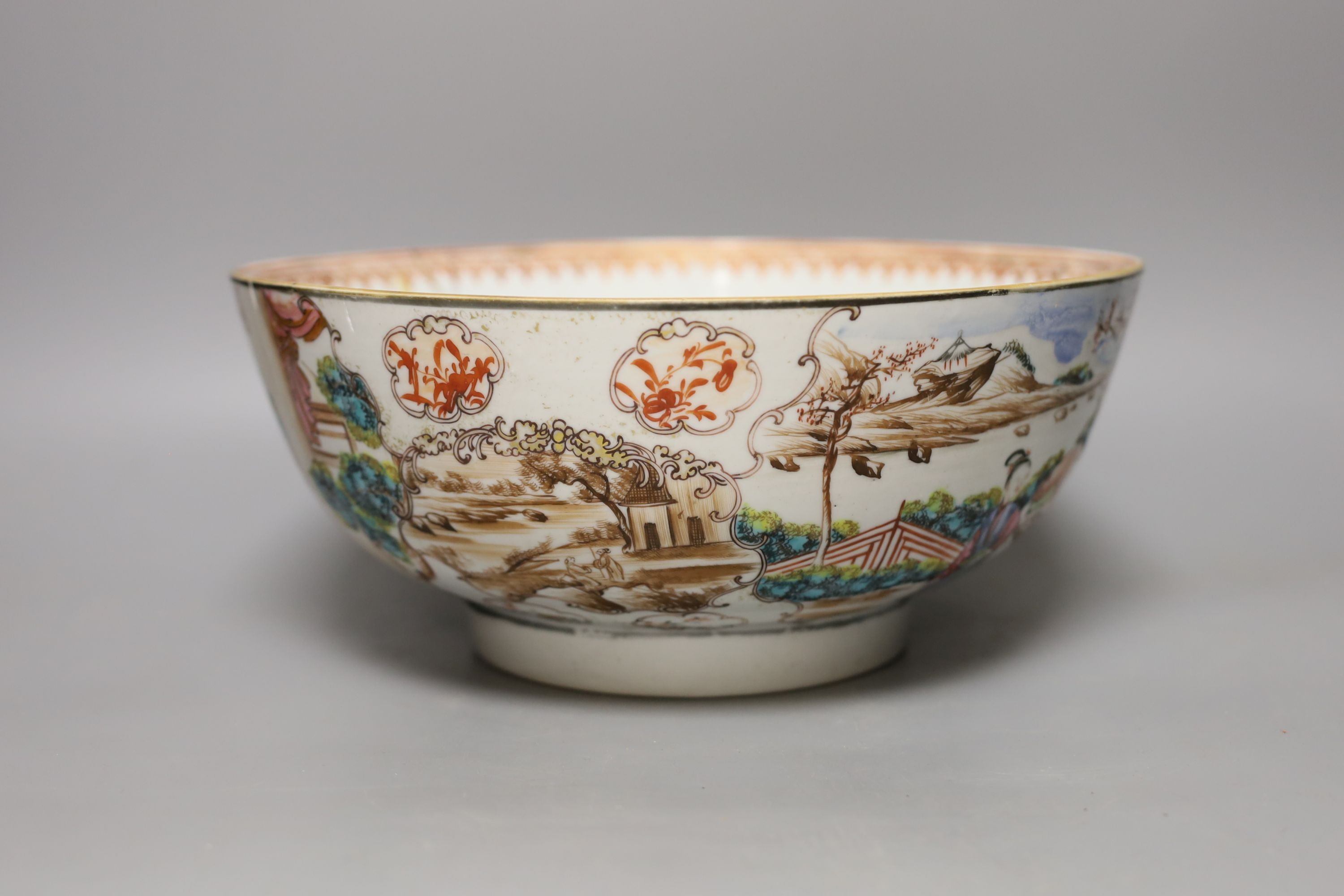 An 18th century Chinese export famille rose punch bowl (with historic damage and riveted repair) 28cm diameter